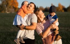 blended family meeting and laughing in the park