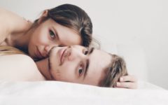 coupe lying in bed speaking about how important is sex