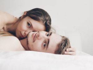 coupe lying in bed speaking about how important is sex