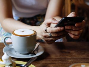 woman using mobile to set up bumble profile