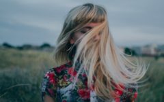 single attractive girl walking in the outdoors celebrating letting go and moving on