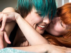 happy lesbian couple laughing after following useful lesbian dating advice