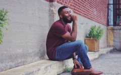 attractive single man sat on a step