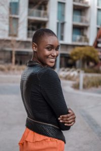 pretty girl looking over her shoulder about to have a conversation