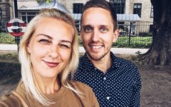 lady and man outside taking a selfie with her looking for signs he's pretending not to like you