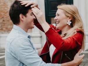 couple laughing as the use new relationship advice to get closer