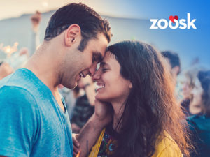 happy couple touching foreheads who met with a Zoosk membership