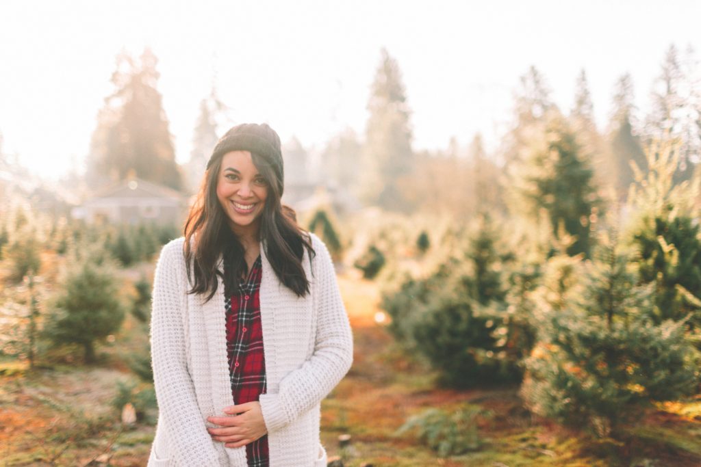 single, divorced woman smiling on a hike outdoors