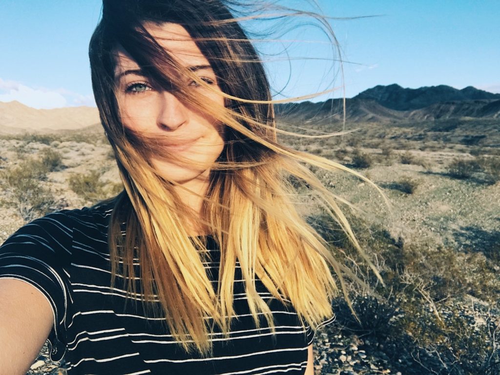 attractive single woman taking a selfie in the desert outside Las Vegas