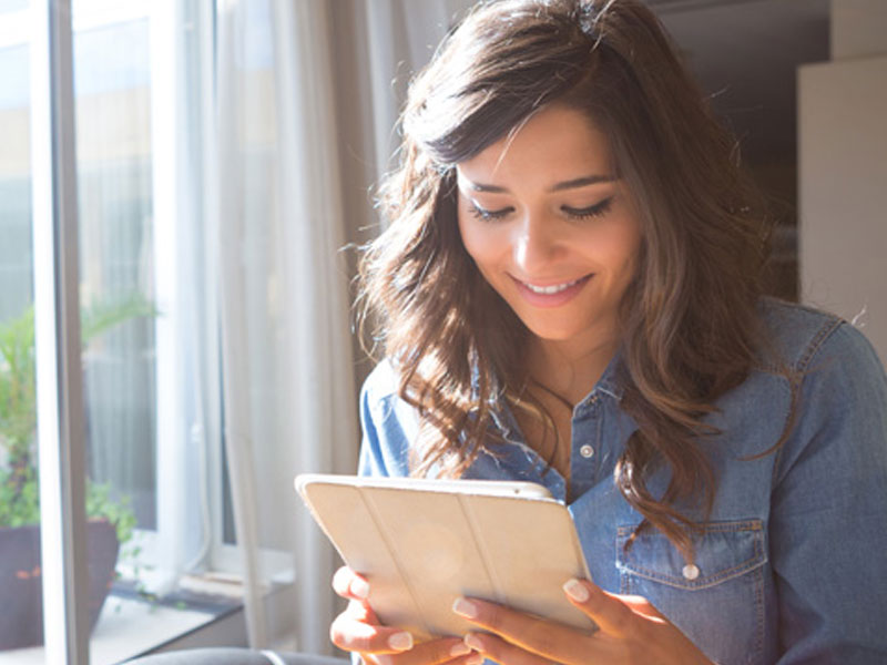 A woman who is flirting online using our helpful tips.