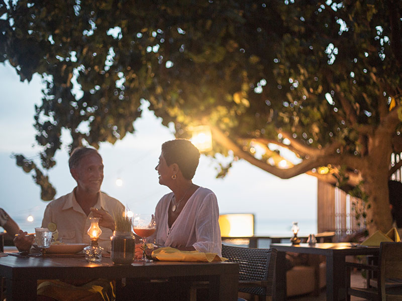 A couple on a date about to get the bill and wondering who should pay.