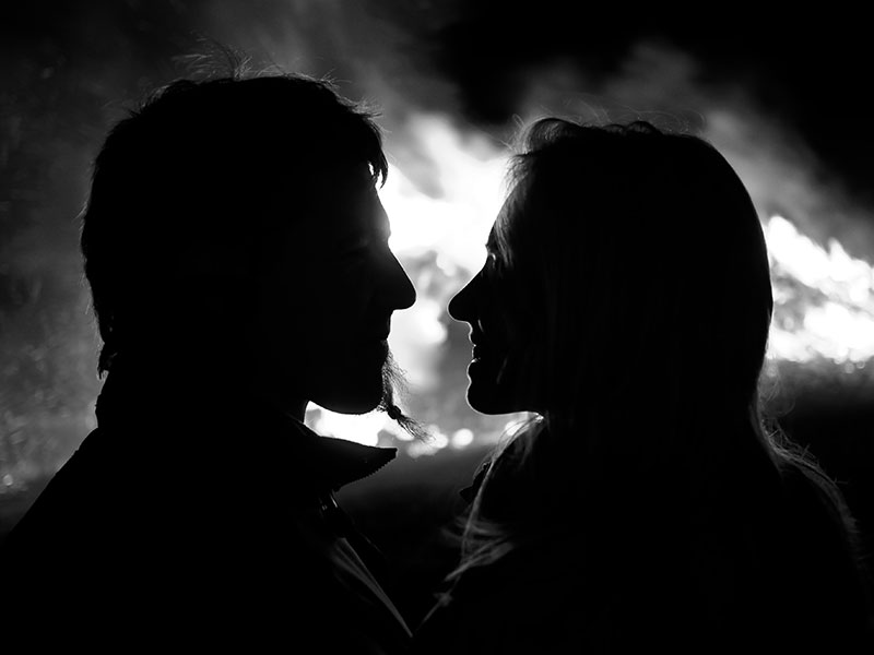 A black and white photo of a couple in a relationship that one of them suspects is fake.