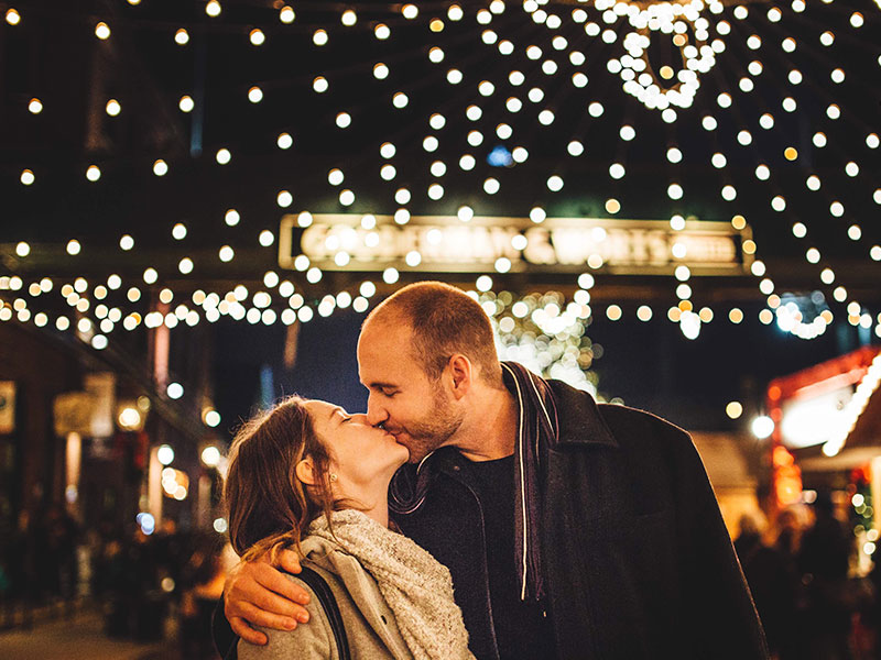 A couple kissing.