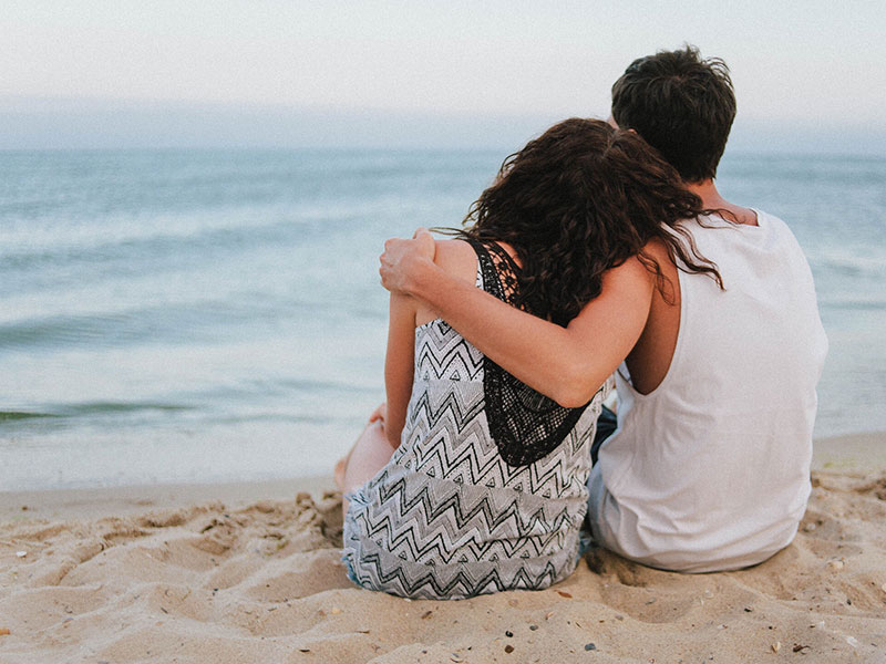 A couple who just broke up hugging, and the man is wondering, “Will my ex come back?”