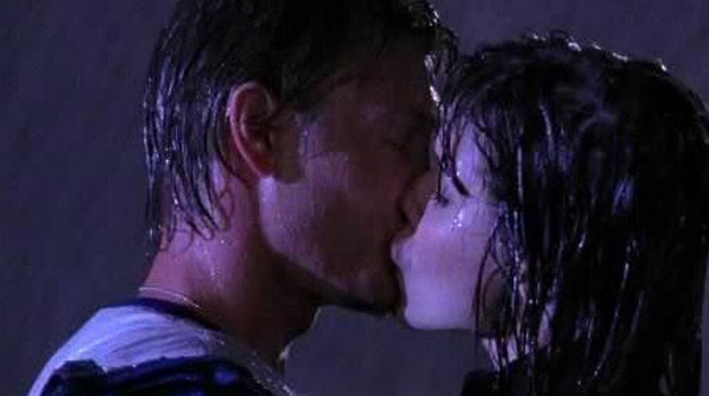 Lucas and Brooke kissing in the rain after his declaration of love.