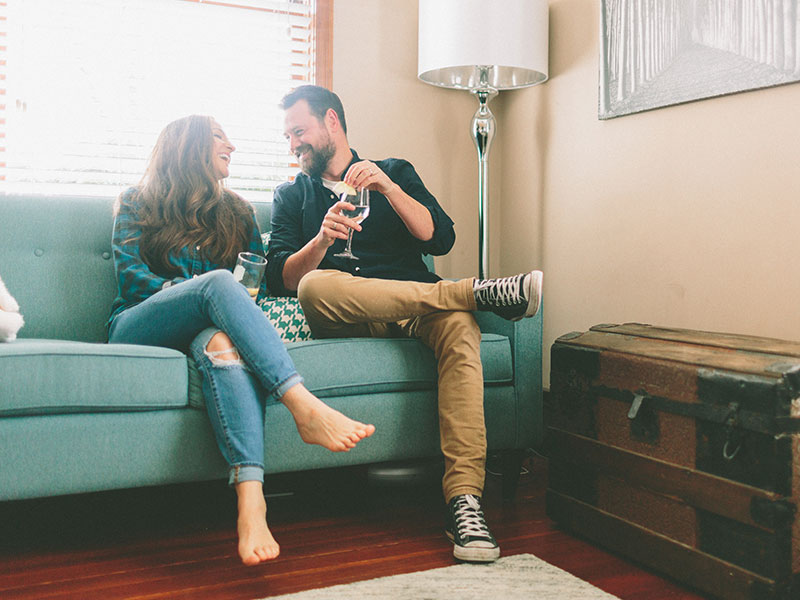 A woman talking to a man and putting out these nonverbal signs she likes you.
