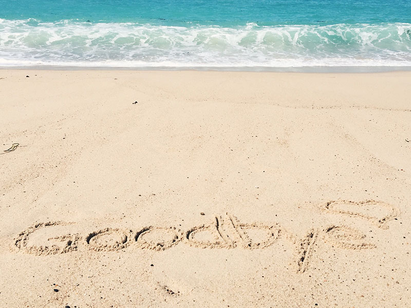 The words goodbye written in the sand on the beach be someone who wanted to know how to get over a guy.