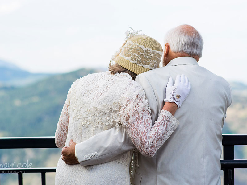 A couple who has relation relationship goals hugging at the beach.