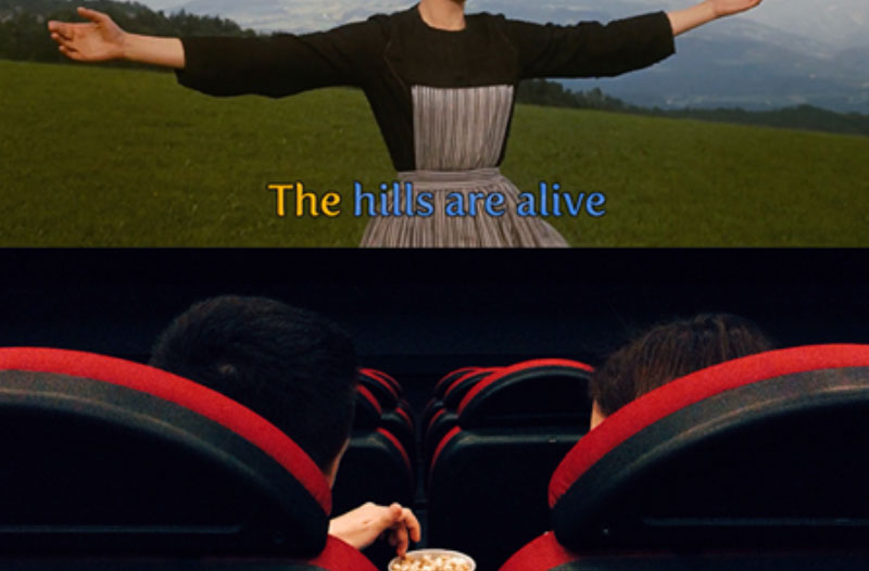 A couple snuggled up while at a singalong, another great winter date idea.
