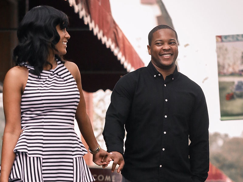 A couple in mature love smiling at each other.