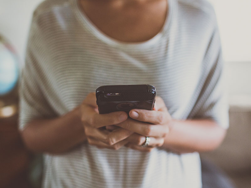 A woman on a dating app who's been ghosting trying to text a guy who's not responding.