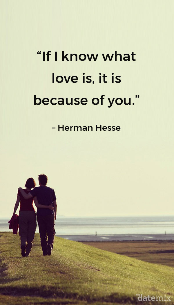 A couple walking hand in hand in a field by the beach with the true love quote below written above them.