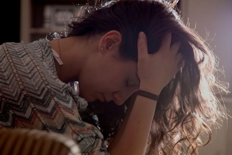 sad woman spotting the signs a relationship is over