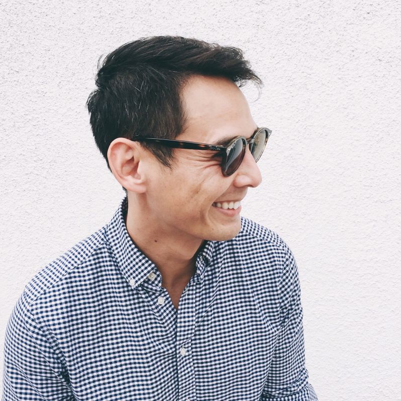 handsome 40-year-old-man smiling with sunglasses on