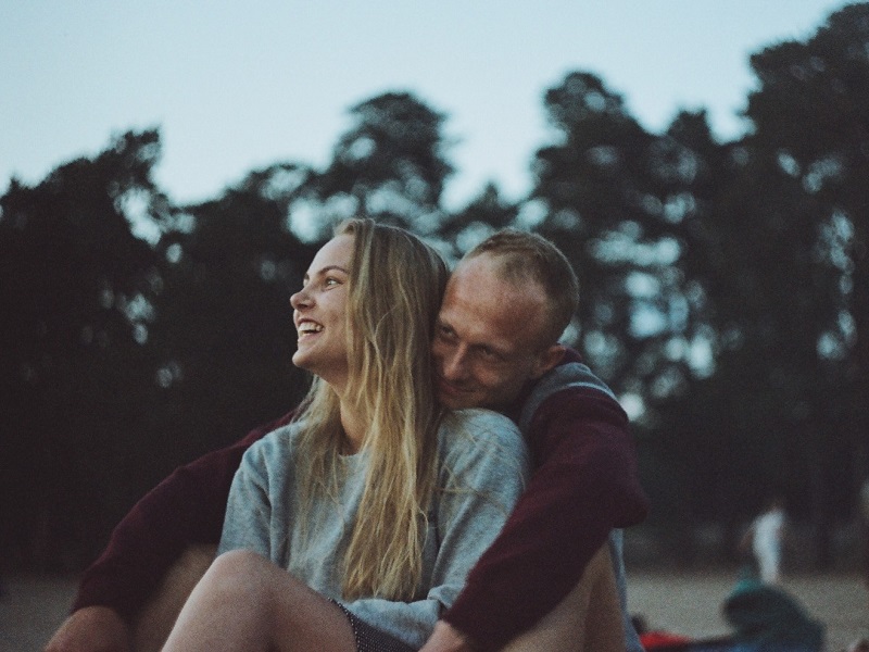 couple in park enjoying a happy relationship