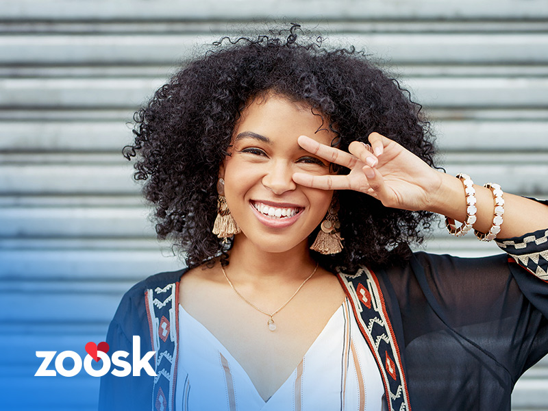 attractive woman smiling from using the Zoosk official site