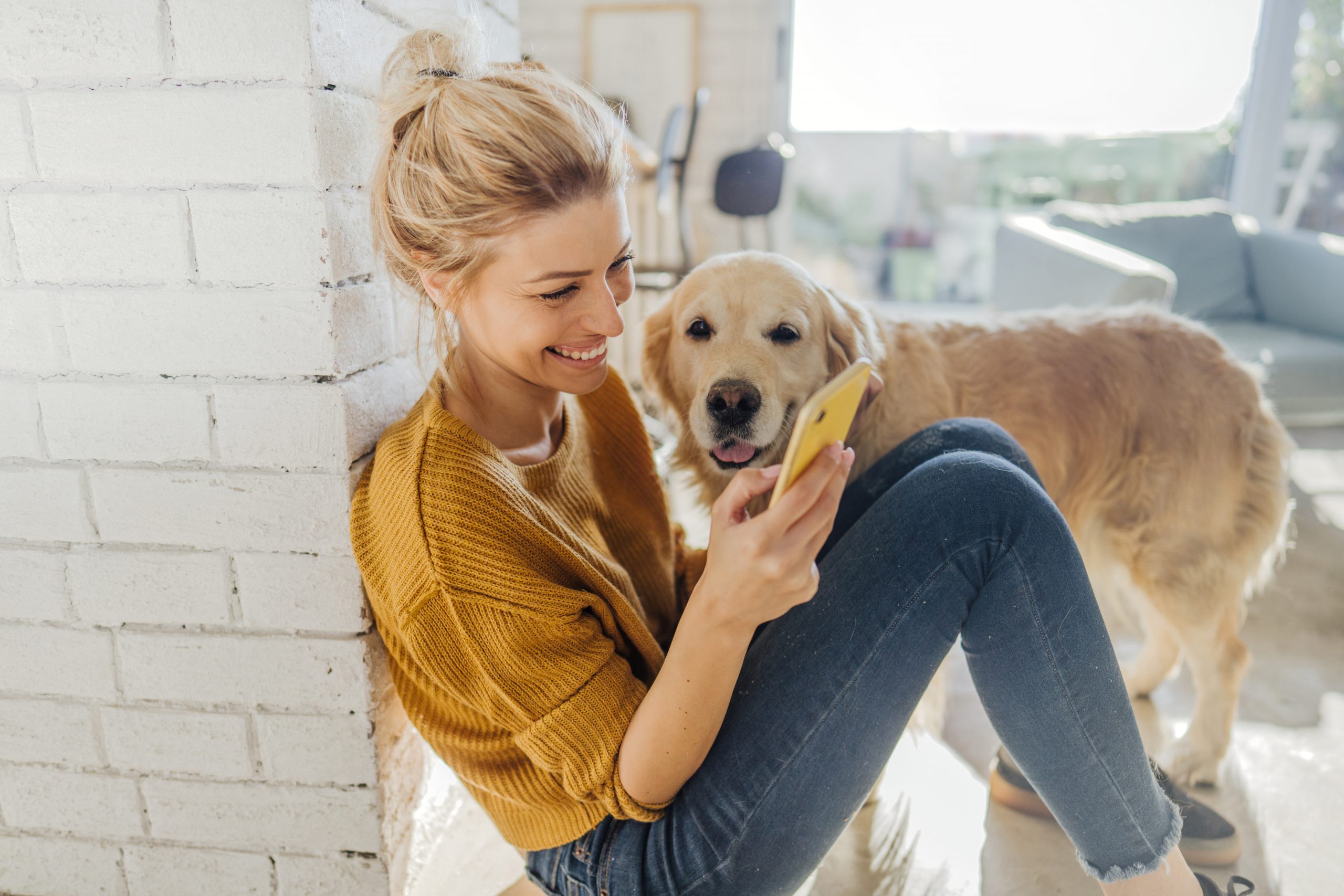 attractive single woman holding phone using a dating app